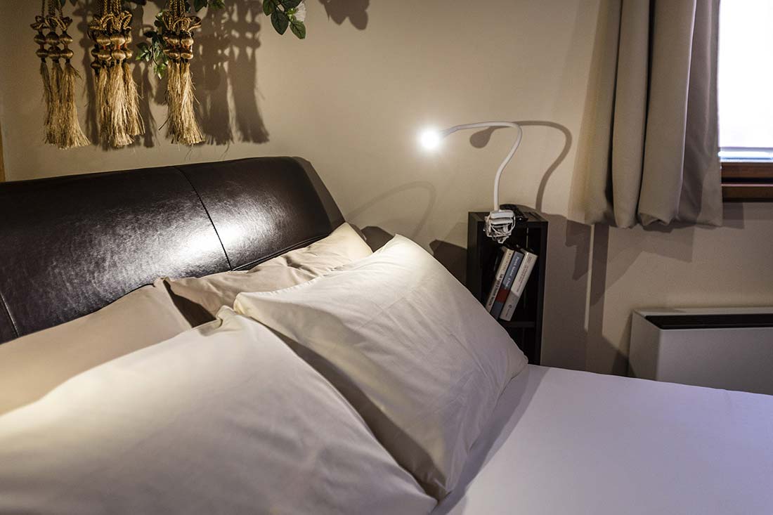 La camera Classic San Michele, presenta uno stile elegante e moderno. Particolare del letto.